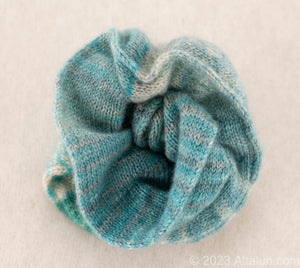 Gentle on Hair, Strong in Hold: Wrap your hair in the softness of cashmere without compromising on strength.  California Craftsmanship: Ethically made in California, our scrunchies feature sustainable cashmere from Mongolian goat herders.  Hand-Dyed Yarn: Choose from a variety of hand-dyed colors, making it a stylish and personalized gift, this is turquoise and green color combo