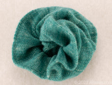 Load image into Gallery viewer, Gentle on Hair, Strong in Hold: Wrap your hair in the softness of cashmere without compromising on strength.  California Craftsmanship: Ethically made in California, our scrunchies feature sustainable cashmere from Mongolian goat herders.  Hand-Dyed Yarn: Choose from a variety of hand-dyed colors, making it a stylish and personalized gift, this one is green with white specks