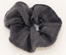 Load image into Gallery viewer, Gentle on Hair, Strong in Hold: Wrap your hair in the softness of cashmere without compromising on strength.  California Craftsmanship: Ethically made in California, our scrunchies feature sustainable cashmere from Mongolian goat herders.  Hand-Dyed Yarn: Choose from a variety of hand-dyed colors, making it a stylish and personalized gift, this one is charcoal grey